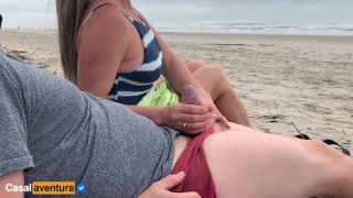 Daring Public Beach Quickie Handjob Amid Passersby – Real Amateur MILF